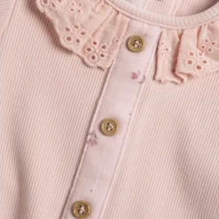 Tutina in caldo tessuto, con apertura sulla schiena e entrogamba ideale per primavera e autunno